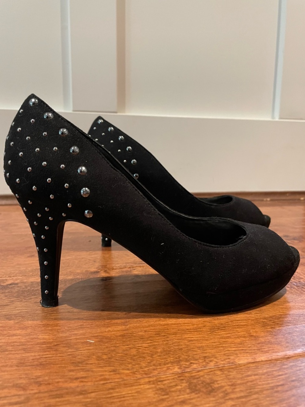 Black studded suede peep toe pumps